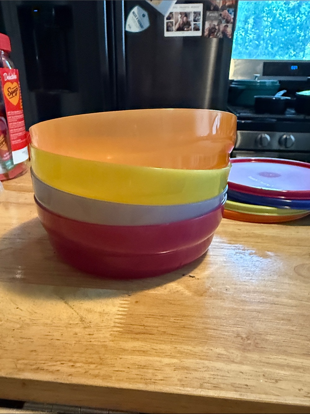 Colorful Stack of Plastic Bowls - Orange, Yellow, Gray, Pink